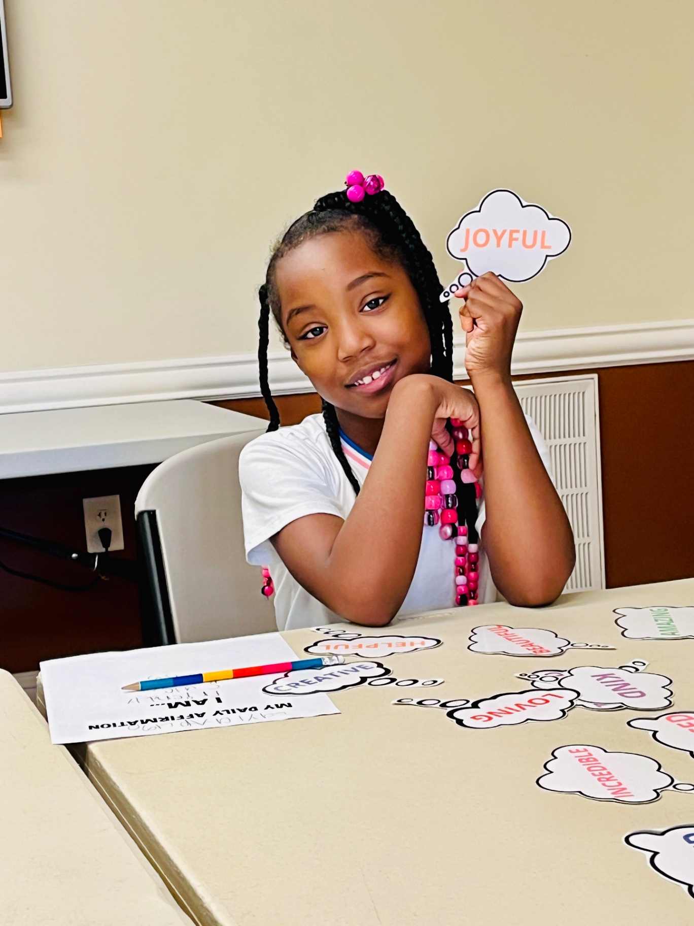 A student sharing a joyful word during a learning activity