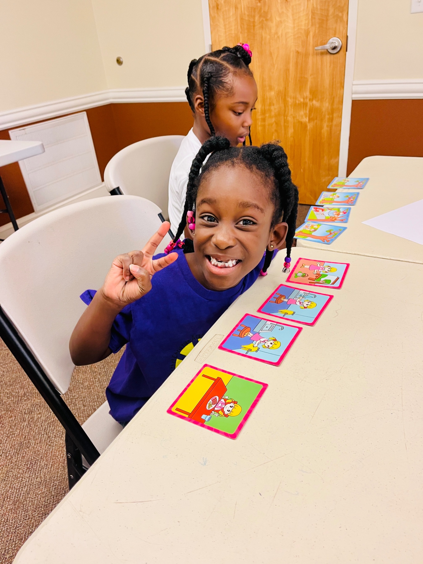 Students arranging picture cards during a sequencing activity